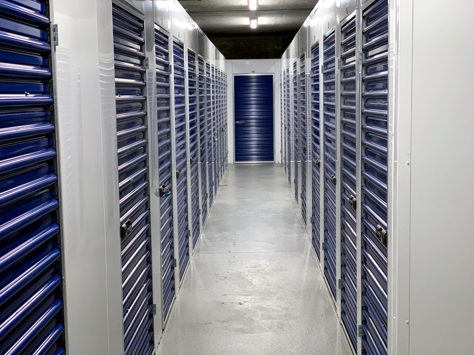 Interior storage corridor with blue locker doors